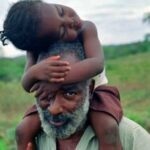 Pg11_David-with-girl-on-shoulders-150×150