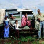 Pg11_Family-at-car-455×300