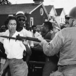 Pg1_Gloria_Richardson_and_protestors_facing_National_Guard_troops_Cambridge_Maryland_ca_1963